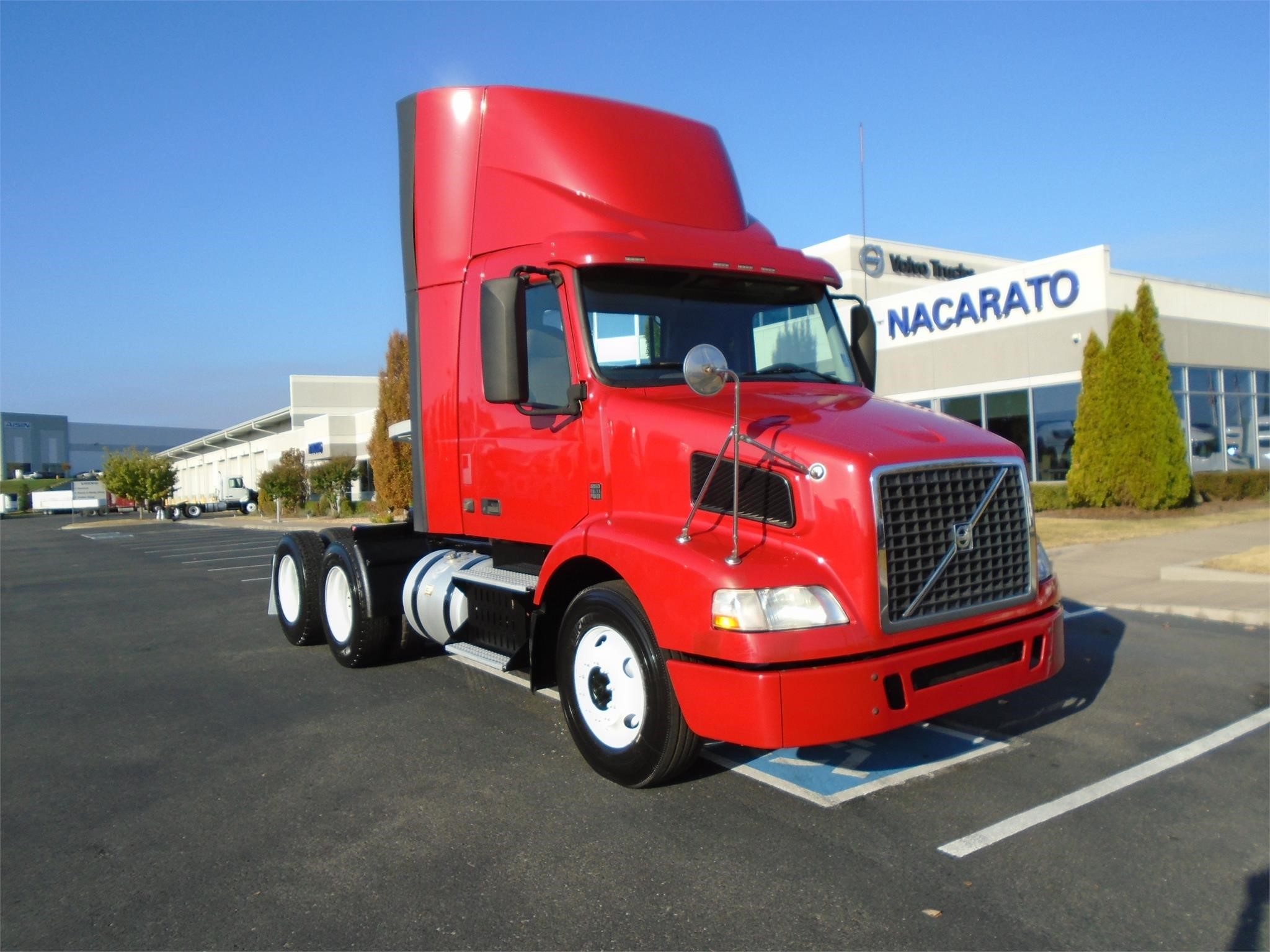 Black 2019 Mack Trucks Anthem™ truck driving down a scenic highway.